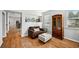 Comfortable living room with wood floors, stylish furniture, and a decorative display shelf at 505 Rendezvous Rd, Acworth, GA 30102