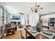 Open concept living and dining area with hardwood floors and abundant natural light at 505 Rendezvous Rd, Acworth, GA 30102
