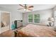 Well-lit main bedroom with hardwood floors, ceiling fan, and ensuite bathroom at 505 Rendezvous Rd, Acworth, GA 30102