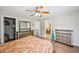 Spacious main bedroom with wood floors, ensuite bathroom, and dresser furniture at 505 Rendezvous Rd, Acworth, GA 30102