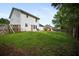 Backyard with a green lawn and a wooden fence at 70 Fairclift Dr, Covington, GA 30016