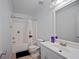 Bathroom with a bathtub, shower, and white sink at 70 Fairclift Dr, Covington, GA 30016