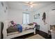 Bedroom featuring a bed with floral sheets, hardwood floors, and natural light at 70 Fairclift Dr, Covington, GA 30016
