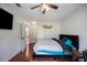 Bright bedroom featuring hardwood floors, neutral walls, and comfortable furnishings at 70 Fairclift Dr, Covington, GA 30016