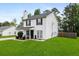 A cozy home featuring a spacious green lawn, black shutters, and a well-maintained exterior at 70 Fairclift Dr, Covington, GA 30016
