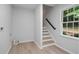 Basement with stairs and a window bringing in natural light at 1368 Christiana Dr, Lawrenceville, GA 30043