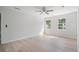 Bright bedroom with wood floors, windows, and a ceiling fan at 1368 Christiana Dr, Lawrenceville, GA 30043