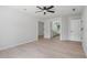 Bright bedroom featuring a modern ceiling fan, light wood floors, and neutral walls at 1368 Christiana Dr, Lawrenceville, GA 30043