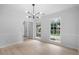 Dining room featuring a modern chandelier and light-colored wood flooring at 1368 Christiana Dr, Lawrenceville, GA 30043