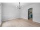 Dining room featuring a modern chandelier and light-colored wood flooring at 1368 Christiana Dr, Lawrenceville, GA 30043