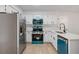Bright kitchen featuring white cabinets and quartz countertops at 1368 Christiana Dr, Lawrenceville, GA 30043