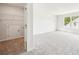 View of a bright carpeted bedroom with closet and a view to the outside at 1471 Stephens View Dr, Loganville, GA 30052