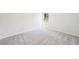 Cozy carpeted bedroom with a view of lush greenery at 1471 Stephens View Dr, Loganville, GA 30052