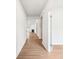 Hallway with wood floors leading to the living area at 1471 Stephens View Dr, Loganville, GA 30052