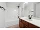 Bathroom with a wooden vanity, tub, shower, and large mirror above the sink at 1736 Dylan Pl, Lawrenceville, GA 30043