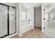 Primary bathroom showcasing glass shower, soaking tub, and tiled flooring at 1736 Dylan Pl, Lawrenceville, GA 30043