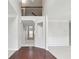 Bright foyer boasts hardwood floors, neutral walls, and a view of the upper level landing at 1736 Dylan Pl, Lawrenceville, GA 30043