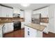 Modern kitchen with granite countertops, stainless steel appliances, and hardwood flooring at 1736 Dylan Pl, Lawrenceville, GA 30043