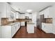 Modern kitchen with granite countertops, stainless steel appliances, and hardwood flooring at 1736 Dylan Pl, Lawrenceville, GA 30043
