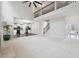 Open living space with hardwood floors leading into an eat-in kitchen, neutral walls, and staircase at 1736 Dylan Pl, Lawrenceville, GA 30043