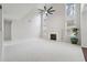 Spacious living room with vaulted ceilings, fireplace, and large windows offering natural light at 1736 Dylan Pl, Lawrenceville, GA 30043