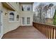 Enjoy outdoor living on this spacious back deck with wooden railing and views of the trees at 340 Kincardine Way, Alpharetta, GA 30022