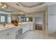 Bright bathroom with double vanity sink, tile floors and modern fixtures at 340 Kincardine Way, Alpharetta, GA 30022