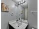 A modern bathroom vanity with a stylish light fixture and decorative mirror at 340 Kincardine Way, Alpharetta, GA 30022
