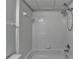 White tiled bathroom with a shower head and bathtub at 340 Kincardine Way, Alpharetta, GA 30022