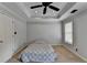 Bedroom features a tray ceiling, ceiling fan, and large window at 340 Kincardine Way, Alpharetta, GA 30022