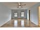 Bedroom featuring hardwood floors, soft blue walls, and two large windows for natural light at 340 Kincardine Way, Alpharetta, GA 30022