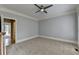 Bedroom with a ceiling fan, soft carpet, and trim details at 340 Kincardine Way, Alpharetta, GA 30022