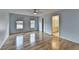 Bright bedroom with hardwood floors, light blue walls, and natural lighting at 340 Kincardine Way, Alpharetta, GA 30022