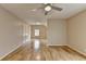 Bright bedroom featuring hardwood floors, neutral walls, and a ceiling fan at 340 Kincardine Way, Alpharetta, GA 30022