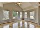 Spacious bedroom showcasing large windows, vaulted ceiling, and hardwood flooring at 340 Kincardine Way, Alpharetta, GA 30022