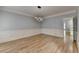 Dining room features hardwood flooring, modern light fixture and wainscoting at 340 Kincardine Way, Alpharetta, GA 30022