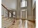 Grand foyer with high ceilings, hardwood floors, staircase, and detailed trim work at 340 Kincardine Way, Alpharetta, GA 30022