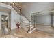 Spacious foyer with hardwood floors and staircase leading to the upper level at 340 Kincardine Way, Alpharetta, GA 30022