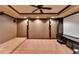 Home theater with tiered seating, plush carpeting, and a large screen at 340 Kincardine Way, Alpharetta, GA 30022