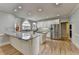 Bright kitchen with white cabinetry, granite countertops, stainless steel appliances, and hardwood flooring at 340 Kincardine Way, Alpharetta, GA 30022