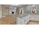 Spacious kitchen with granite countertops and hardwood floors connects seamlessly to the living room at 340 Kincardine Way, Alpharetta, GA 30022