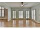 Bright living room boasting hardwood floors, plantation shutters, and ample natural light at 340 Kincardine Way, Alpharetta, GA 30022