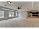 Expansive living room with neutral carpet, recessed lighting, and access to the backyard at 340 Kincardine Way, Alpharetta, GA 30022