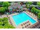 Aerial view of a refreshing community swimming pool with ample seating and luxurious landscaping at 340 Kincardine Way, Alpharetta, GA 30022