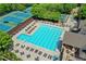 Aerial view of a pristine community swimming pool with lounge chairs and a kiddie pool at 340 Kincardine Way, Alpharetta, GA 30022