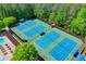 Aeral view of pristine community tennis courts with lush green landscaping at 340 Kincardine Way, Alpharetta, GA 30022