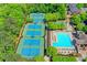 Aerial view of community tennis courts and pool area with lush green landscaping at 340 Kincardine Way, Alpharetta, GA 30022