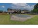 Spacious backyard features a covered pool, basketball hoop, and access to the home's deck at 102 Peaceful Vw, Acworth, GA 30102