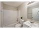 This bathroom features a shower and tub combination, white vanity and cabinets, and modern lighting at 102 Peaceful Vw, Acworth, GA 30102