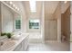 Bathroom offering double sinks, a tub, a shower, and white tile flooring at 102 Peaceful Vw, Acworth, GA 30102